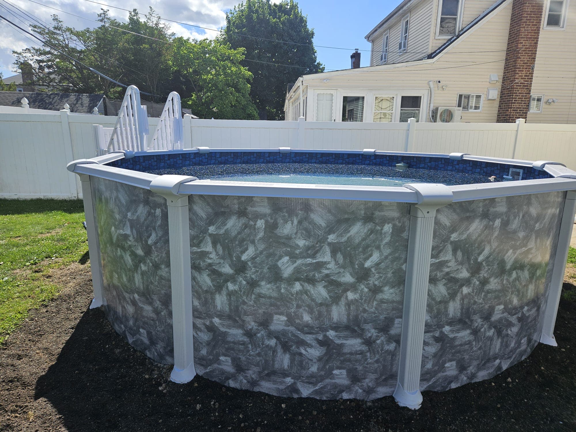 Negril above-ground pool installed in a fenced backyard